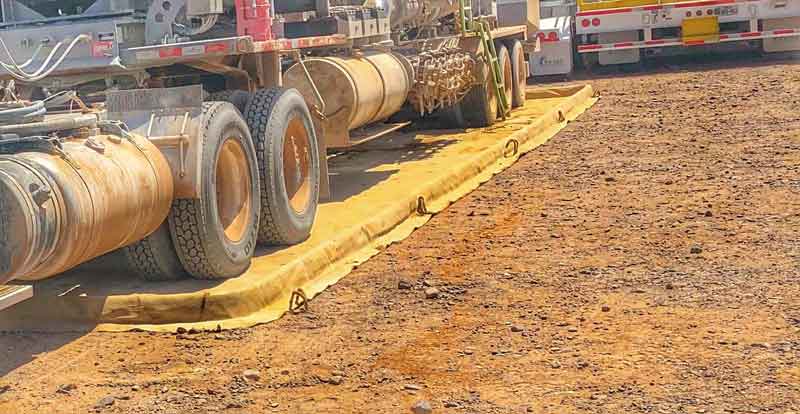 Drive-over containment with trucks